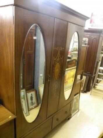 An Edwardian mahogany and marquetry wardrobe