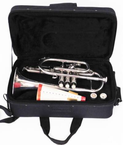 A 20thC Yamaha Maestro cornet in chrome colours, with three buttons, 36cm wide, with various mouth pieces in fitted case.