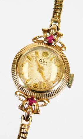 A 9ct gold ladies cocktail watch, with 1cm diameter dial, with baton and Arabic numerals, with an entwined bracelet.