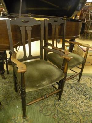 A pair of oak open armchairs