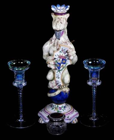 Various collectables, etc., an unusual tin glazed earthenware griffin candlestick holding shield, polychrome decorated on paw feet, 38cm high, two elaborate drinking glasses with turned stems, a tortoise shell finish jar. (a quantity)