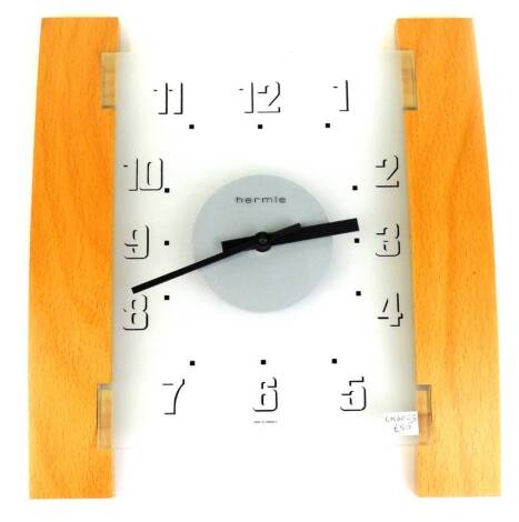 An Art Deco style retro Hermle wall clock, with lightwood sides and Arabic dial, 28cm wide.