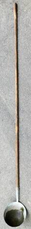 A late 19thC bran ladle, with cylindrical handle and plain bowl, 246cm high.