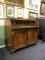 A mid 19thC mahogany and rosewood cross banded cylinder bureau