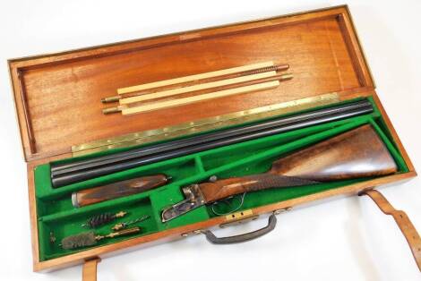 A Regent Mundial 20 bore side by side shotgun, non-ejector, serial No. 181009, in a brass and leather bound teak case. NB. A valid shotgun certificate is required to view, bid or collect this weapon.