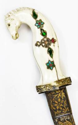 A 19thC Indian Shamshir sword, the slightly curved blade decorated with a hunting scene in gold inlay, the ivory grip carved with a horse's head and inset with semi precious stones, with the scabbard having embroidered cloth covering and chain hanger, 73 - 2