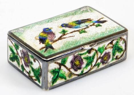 A mid 20thC enamel casket, of rectangular form, marked to Lady Hailey from the Oudh Ladies Club, profusely decorated with birds and flowers on a white ground, 7cm wide.