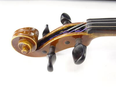 A 20thC violin, with a two piece back, carved scroll, unmarked, length of back 35.5cm and a bow with nickel plated mounts. - 4