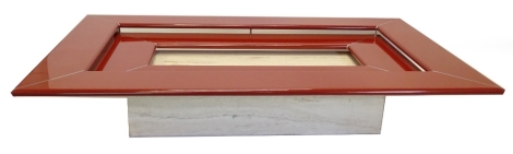 A Paulo Piva red lacquer and chrome plated coffee table, on a variegated marble rectangular base, 23cm high, the top 107cm x 169cm.