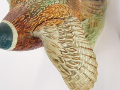 A Beswick pottery model of a pheasant, impressed and printed marks to underside, number 1225, and another Beswick model of a pheasant, (the smaller example AF), (2) - 2