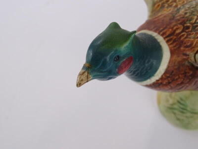 A Beswick pottery model of a pheasant, impressed and printed marks to underside, number 1225, and another Beswick model of a pheasant, (the smaller example AF), (2) - 3