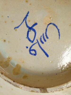 An Iznik pottery bowl, decorated with roundel's around a central inscription, inscribed mark to underside, 38cm diameter. - 3