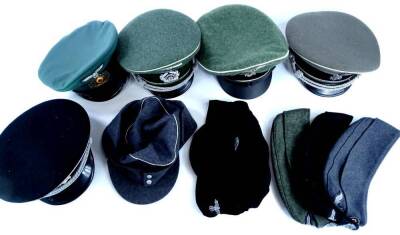 A quantity of replica WWII German crusher/side caps, etc, some with badges. (10)