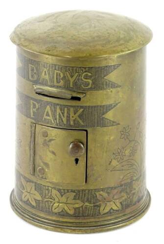 An unusual brass Trench Art child's money box, modelled in the form of a letterbox with hinged door, slot for letters, etc., various numbers to underside of shell, 13.5cm high.