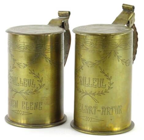 An unusual pair of French Trench Art tankards, each bearing the inscription Bailleul Herven Elene and Bailleul Varmelart-Artur, shells themselves dated April 1918 and May 1917 respectively, 15cm high.