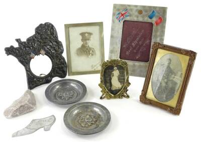 A collection of First World War related frames etc., to include a cast example depicting France, a plated frame set with a photograph titled Allen 1917, a photograph depicting a soldier within a plain gilt frame, two cast regimental alloy dishes, an Ypres