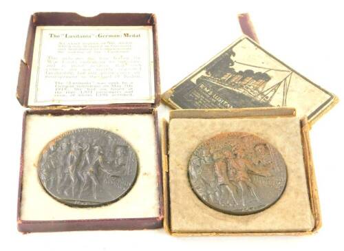 Two cast metal Lusitania propaganda medals, boxes AF.