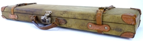 A canvas and leather shot gun case, bearing facsimile label for Manton & Co Ltd, gunmakers Calcutta and Delhi, 76cm wide.