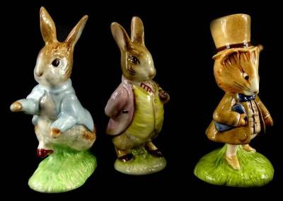 Three Beswick Beatrix Potter figures, a John Beswick Benjamin Bunny, a Beswick Amiable Guinea Pig, brown back stamp, and a Beswick ware Peter Rabbit, later gold Royal Doulton backstamp.