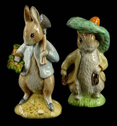 Two Beswick Beatrix Potter figures, Peter Rabbit Gardening and Benjamin Bunny, one brown backstamp, the other a later gold backstamp.