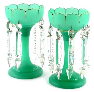 A pair of Victorian green frosted opaque glass table lustres, each with gilt decoration, some damage and losses to lustres, etc. 24.5cm high.