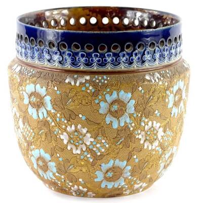 A Doulton Lambeth Slaters Patent jardiniere, with a pierced blue border, and turquoise and white floral and leafy scaled sides, various impress marks to underside to include the initials ES, 18cm high.