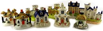 A collection of late Staffordshire type cottages, spill vases, etc., to include Stanfield Hall, Balmoral Castle, etc.
