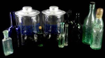 A pair of glass and aluminium biscuit barrels, stamped Meredith & Drew Limited and various glass bottles.