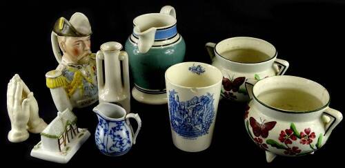 A collection of ceramics, to include a mocha ware pint jug, a pair of Staffordshire cauldrons, each decorated with butterflies, flowers, etc. a King George V commemorative jug, etc.