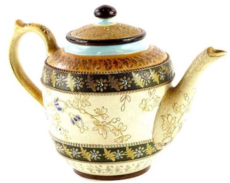 A Doulton Lambeth Slater's patent teapot, decorated with bands of shaded brown, picked out in gilt, turquoise etc. with a design of flowers and leaves, impress marked to underside, 77cm high.