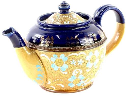 A Royal Doulton Slater's patent teapot, decorated with a blue band with gilt leaves, above a band of flowers, in turquoise and white, etc., impress marks to underside, 14cm high.