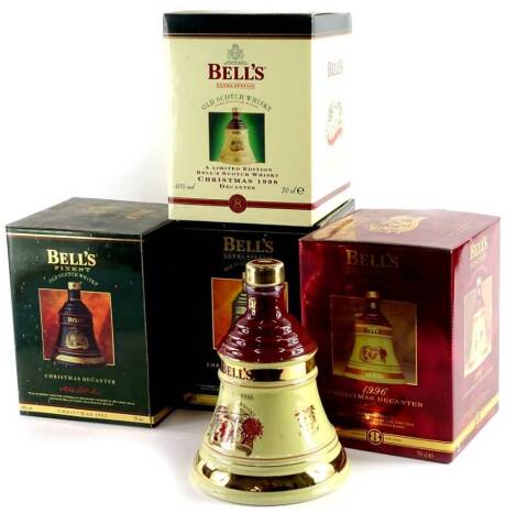 Four bottles of Bells Christmas commemorative whisky, for 1996, 1988, 1995 and 1992, three aged 8 years.