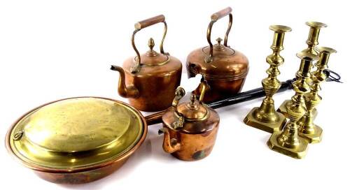 Various metalware, to include three Victorian copper kettles, and two pairs of brass candlesticks.