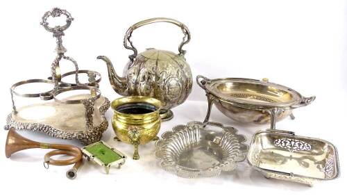 A quantity of silver plate, to include an embossed kettle, a breakfast dish with revolving lid, tantalus with leaf cast borders, etc.