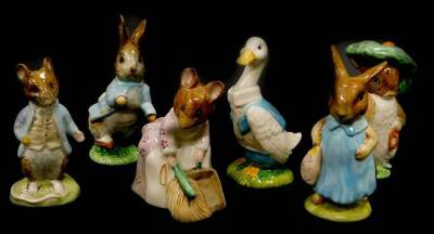 A collection of Beswick Beatrix Potter figures, Benjamin Bunny, Mr Drake Puddle duck, Mrs Flopsy Bunny, Hunca Munca Sweeping, Peter Rabbit and Town Mouse, brown backstamp.