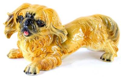 A Goebel ceramic large model of a Pekingese dog, printed marks in blue to underside, 31cm long.