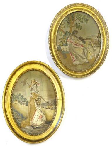 A pair of 19thC embroidered silk pictures, depicting lady sitting before a tree, another with a rake etc., oval, 22.5cm x 16cm.