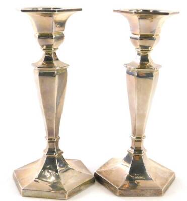 A pair of George V silver candlesticks, of octagonal form, Birmingham 1932, loaded, 17.5cm high.