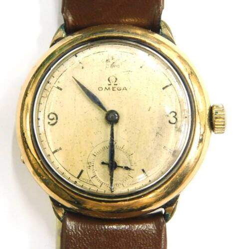 An Omega gentleman's wrist watch, with swiss 15 jewel movement, silver coloured style, blue hands in second style, rubbed and marked in a gold coloured casing, on later brown leather strap.