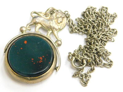 A silver lion headed swivel agate fob, set with green and orange agate, with lion to top, on a silver plated chain.