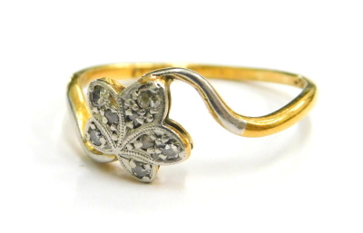 An 18ct gold and platinum leaf design dress ring, with single five leaf set with tiny diamonds, on a platinum twist setting, on a plain yellow metal band, ring size O, 2g all in, boxed.