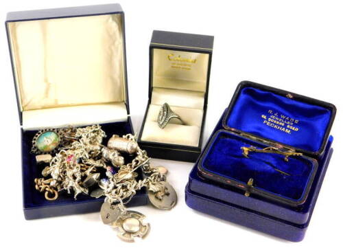 Various costume jewellery and effects, to include a silver charm bracelet with a mixture of silver and silver plated charms, another, a silver filigree floral brooch, two part chains, a Taj Mahal enamel painted and silver plated framed brooch, a marcasite