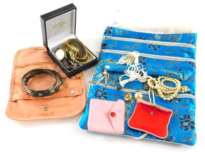 A quantity of modern costume jewellery and effects, to include two silver bangles, faux pearl necklace, clip on earrings, silver plated chains, brooches, dress rings, wristwatches, etc. (a quantity)