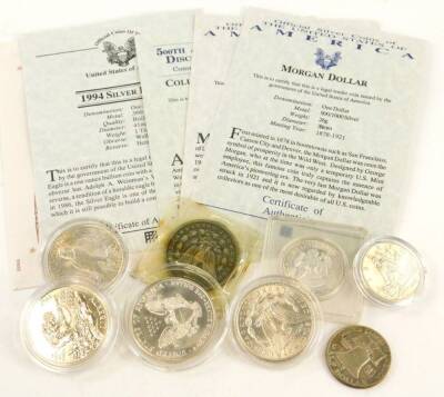 A collection of American coins, to include 1891 dollar, a Morgan dollar from 1889 with certificate and 1961 half dollar and four other American coins each with certificates.