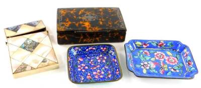 A late 19thC simulated tortoiseshell papier mache snuff box, with a raised vacant cartouche, 9½ cm wide, an early 20thC canton enamel dish of shaped form, another and a mother of pearl card case of small proportion (4).