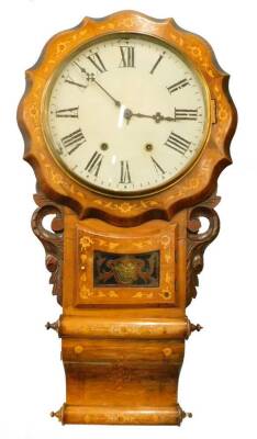 A late 19thc marquetry inlaid American drop dial wall clock, the 29cm diameter Roman numeric dial in a shaped case, profusely inlaid with flowers and leaves, above a visible pendulum flanked by carved sections with a scroll base, eight day movement, 84cm