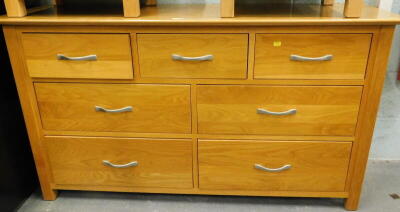 An oak chest of three short and four long drawers.