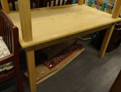 A stripped pine kitchen table.