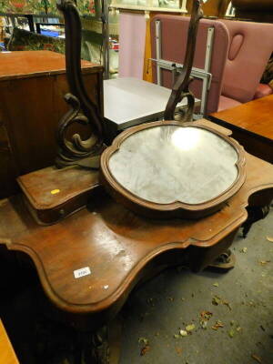 A Victorian mahogany veneered Duchess dressing table, the shaped mirror on pierced supports, the serpentine shaped base with small frieze drawer on cabriole supports with platform, (AF), 120cm W.