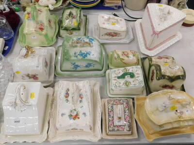 A collection of 19thC and later cheese dishes and covers, to include floral examples, a basket weave design example, etc. (a quantity).
